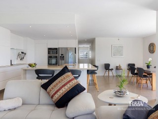 Show-stopping family home just steps from the beach