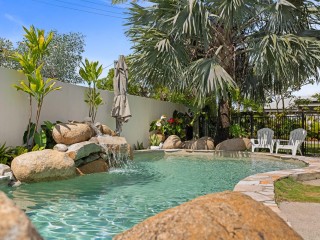 Beachside Delight: North Facing Pool & Lush Gardens